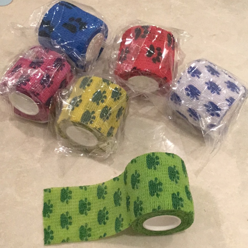 Brand new in packaging! Six rolls dog tape